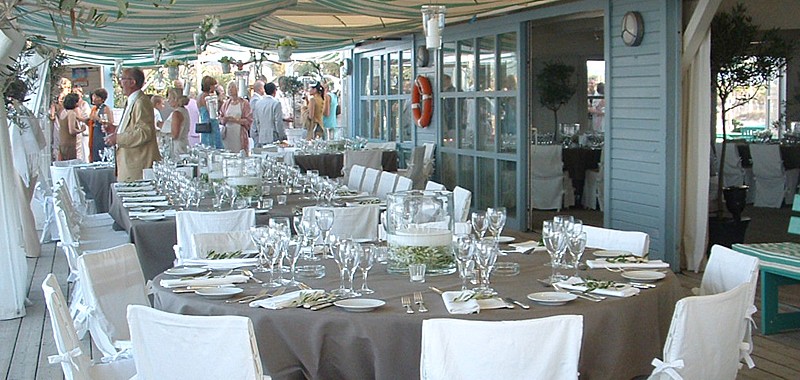 Tables set for a wedding at la plage des jumeaux